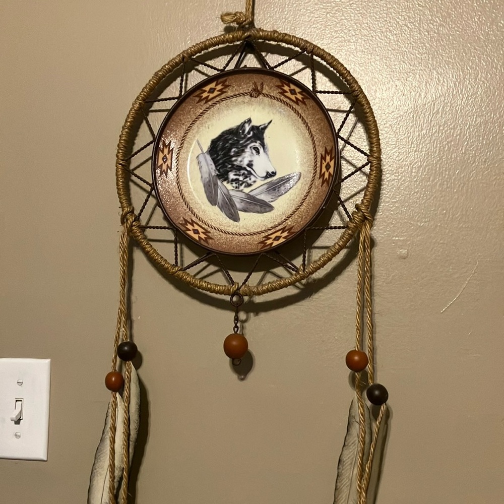 Native American wolf wall hangingg. ceramic plate with decoration and rope
